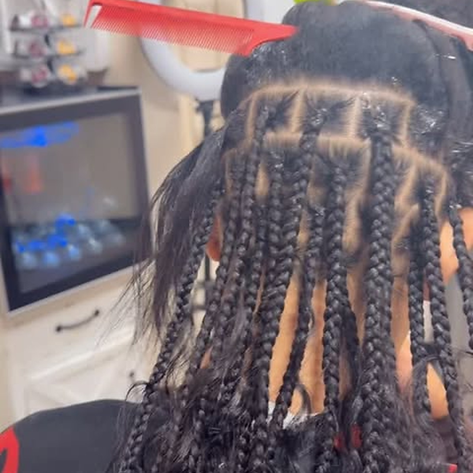 Medium knotless boho — Parted in a grid, braided down the back