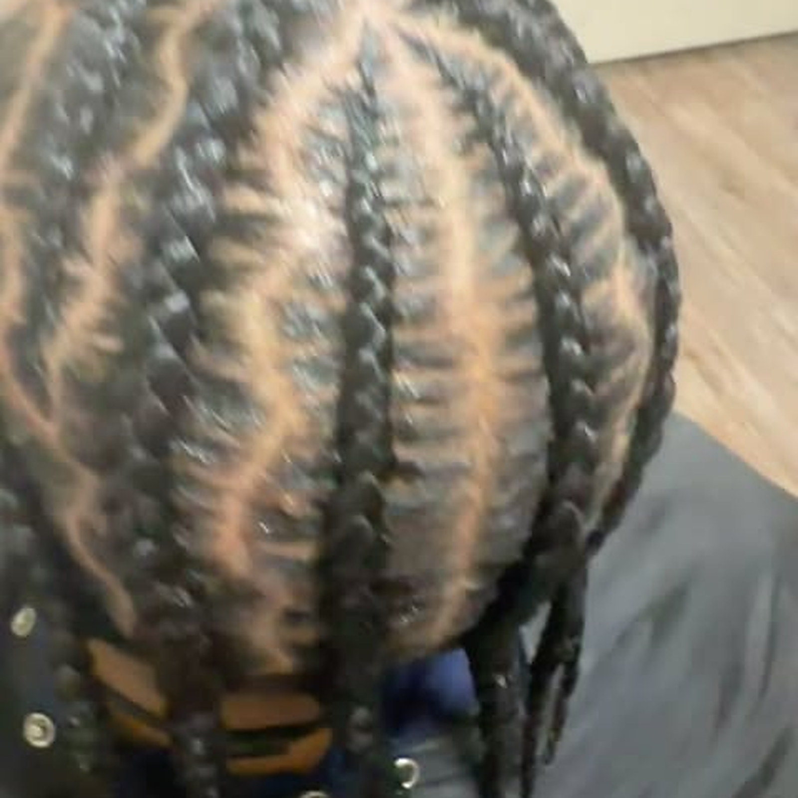 Straight-back cornrows — Rows braided straight to the back, tails left loose